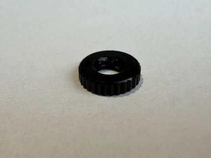 Single 1.5mm M3 aluminum FPV stack nut, anodized black knurled detail